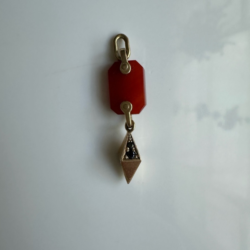 Hand cut carnelian, 14k yellow gold and black diamond charm